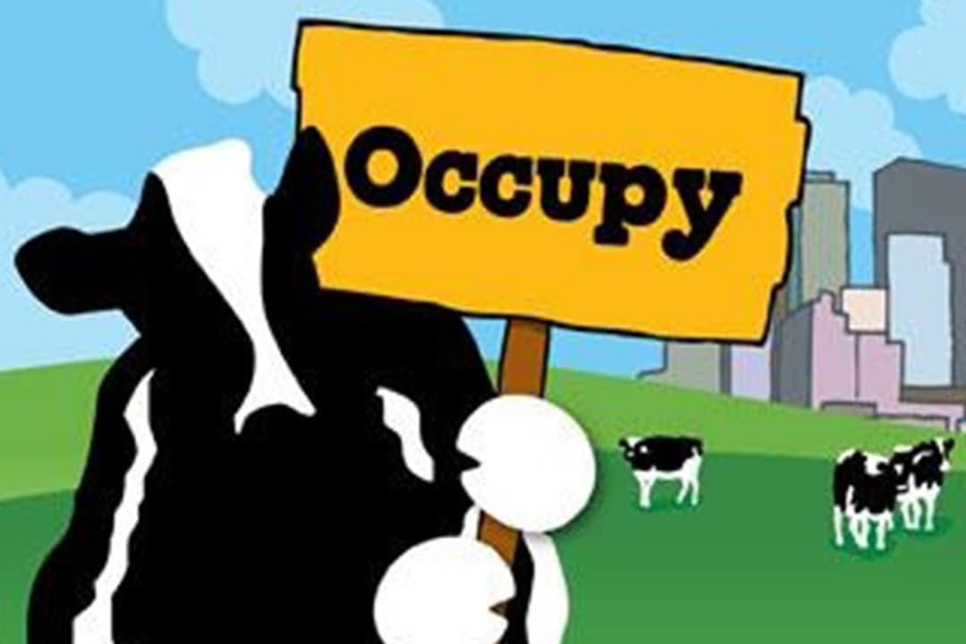 Woodie holder et skilt som sier Occupy!